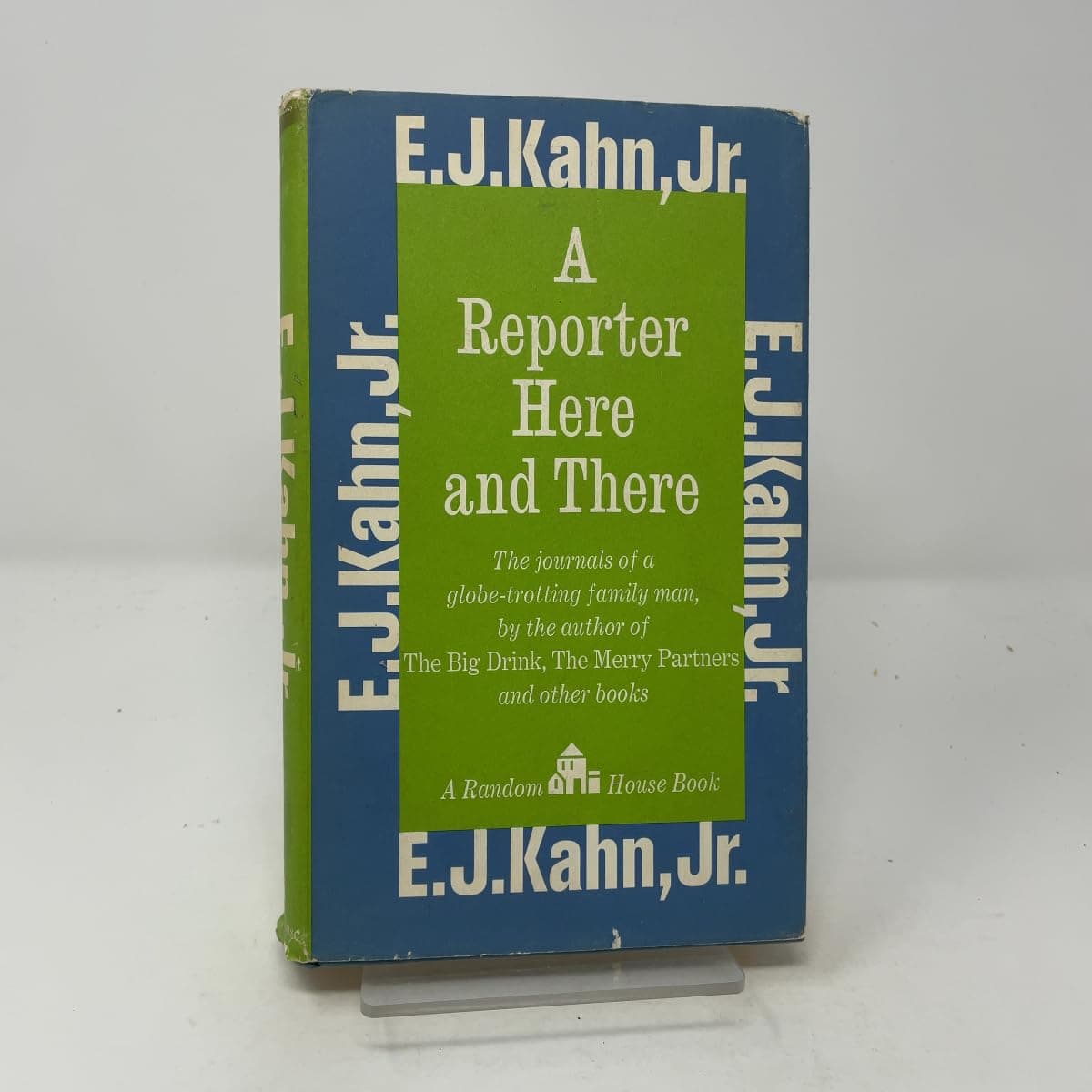 A reporter here and there Kahn, E. J by null