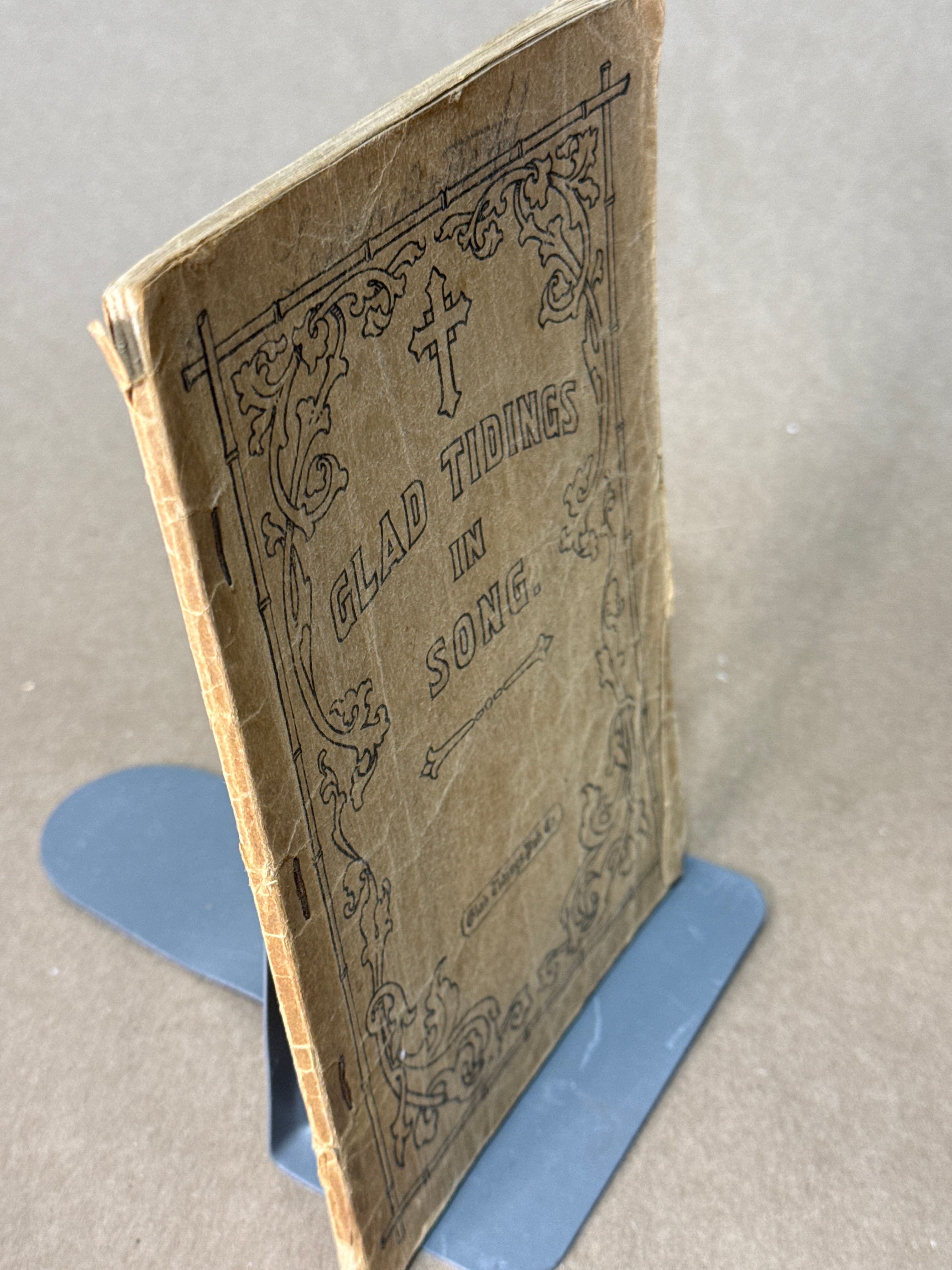 Glad Tidings in Song by Edited and Compiled by Revs. W. E. Biederwolf, John S. Hamilton, Bob Jones, E. C. Miller, H. W. Stough - quarter view showing binding condition