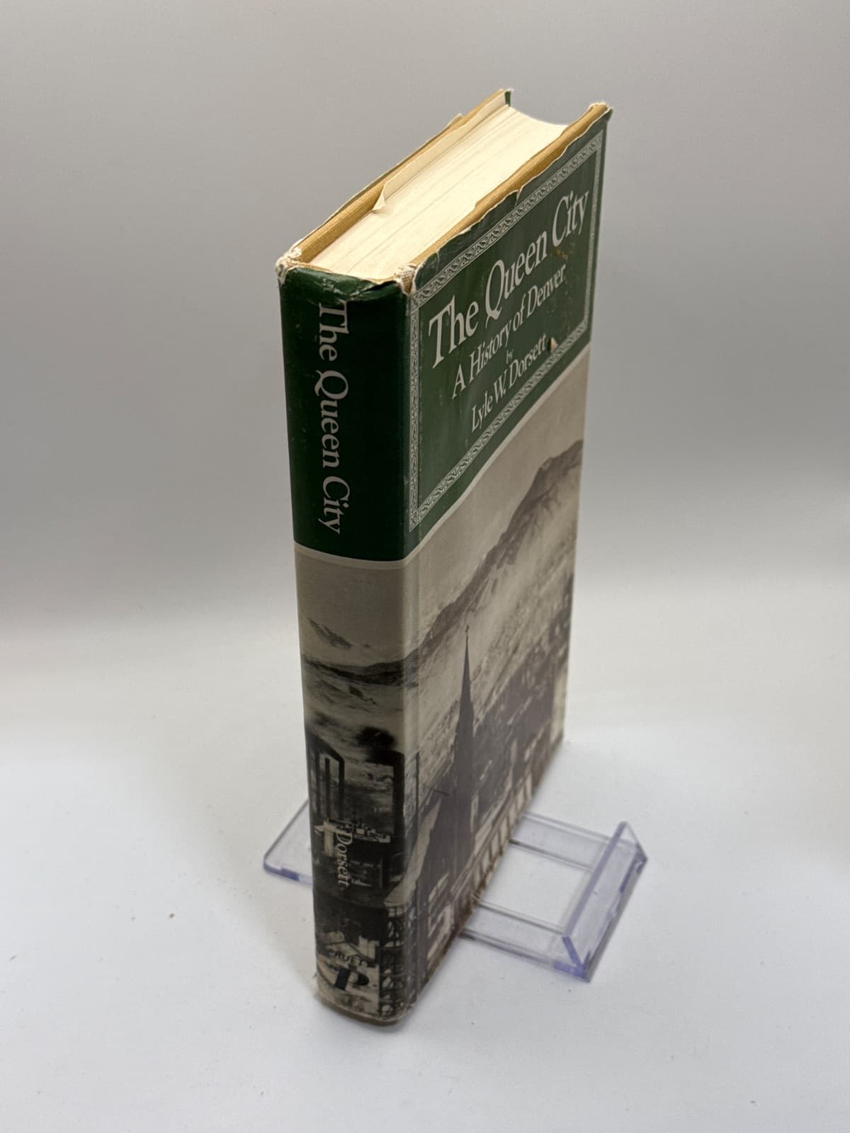The Queen City: A History of Denver by Lyle W. Dorsett - quarter view showing binding condition