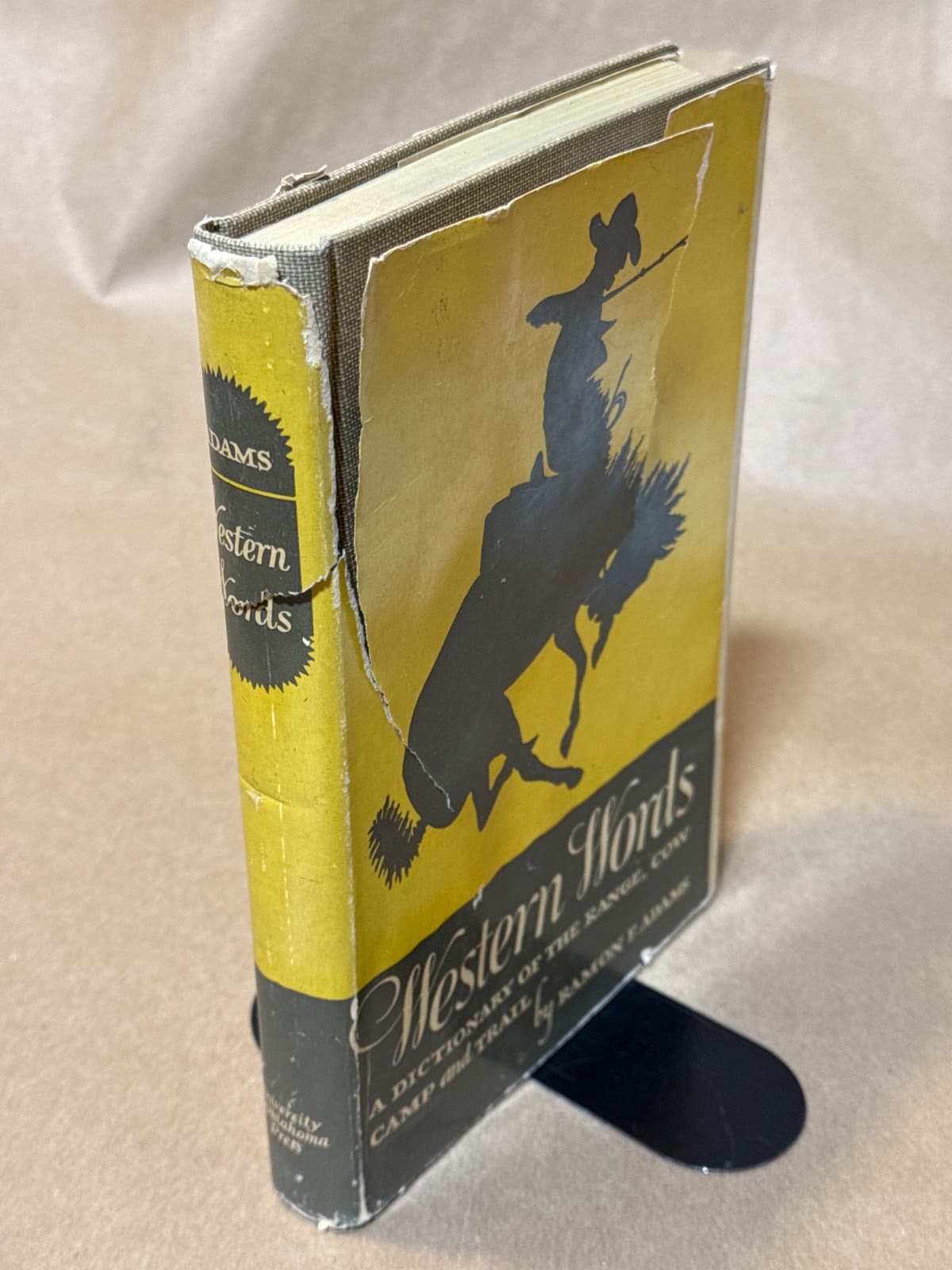 Western Words: A Dictionary of the Range, Cow Camp and Trail by Ramon F. Adams - quarter view showing binding condition