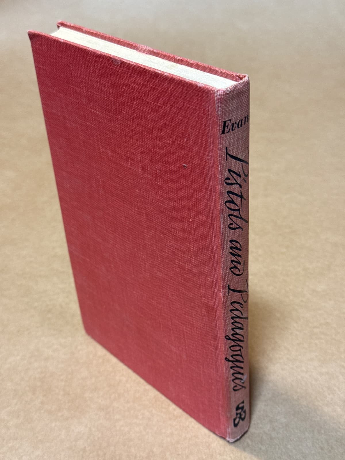 Pistols and Pedagogues by Fallon Evans - quarter view showing binding condition