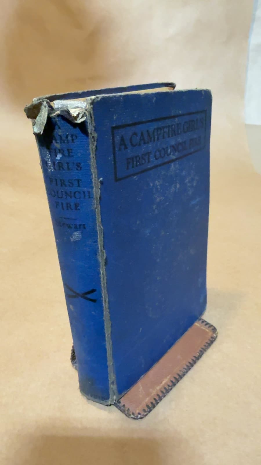 A Campfire Girl's First Council Fire by Jane L. Stewart - quarter view showing binding condition
