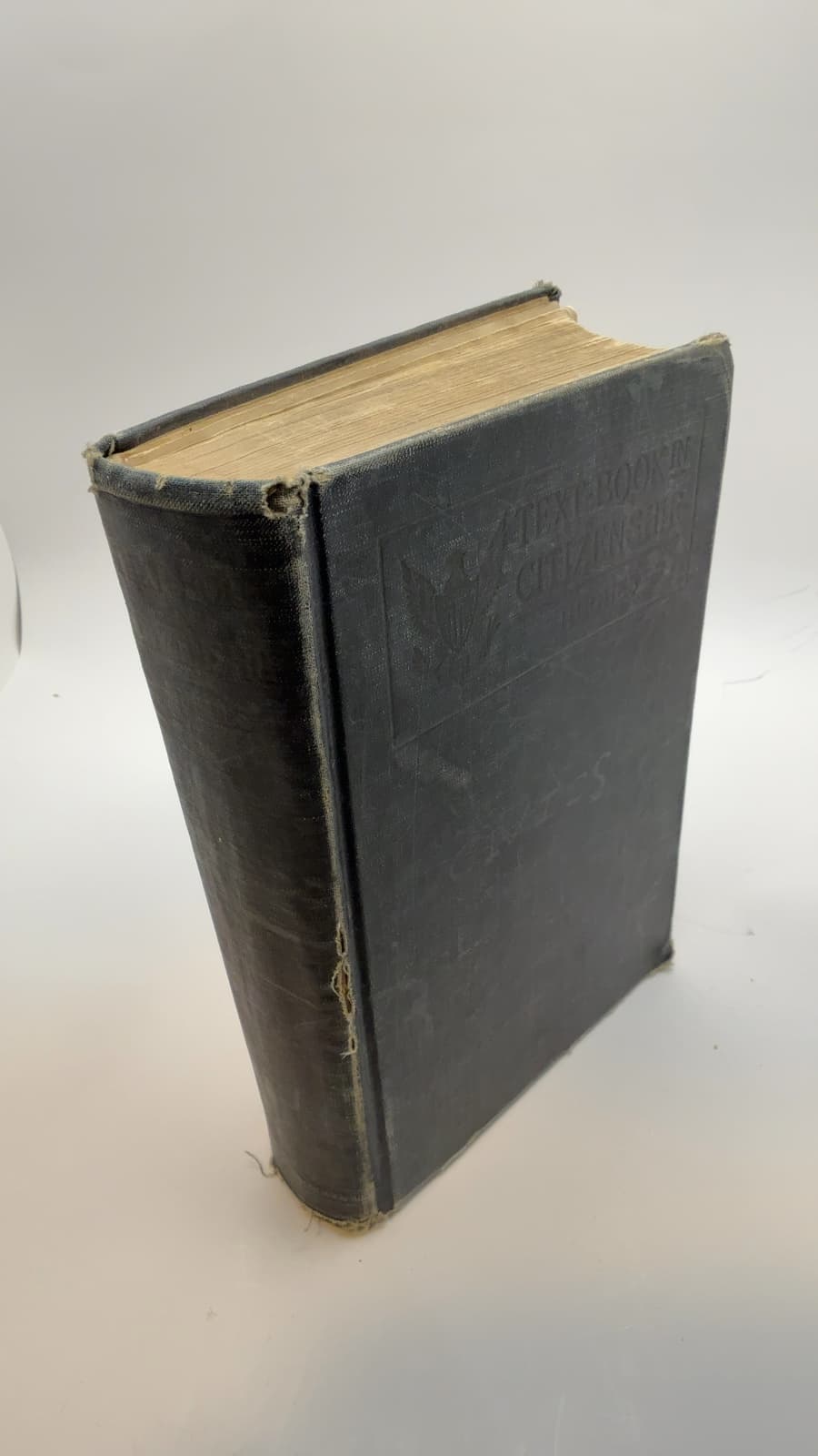 A text-book in citizenship;: Community civics, economic civics, vocational civics, [Hardcover] Hughes, R.O. - quarter view showing binding condition