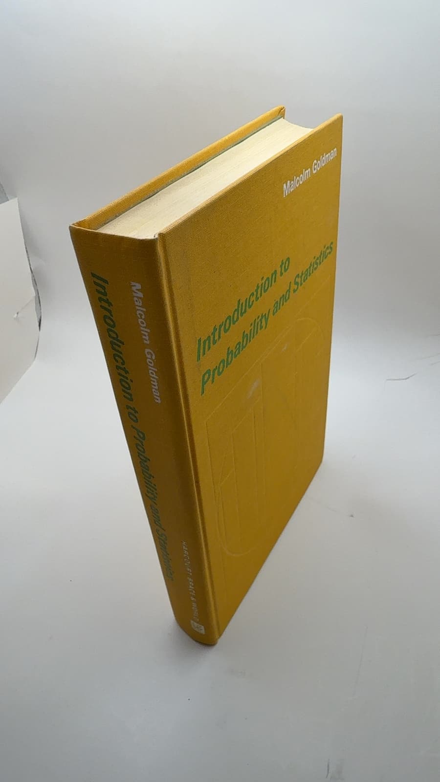 Introduction to Probability and Statistics by Malcolm Goldman - quarter view showing binding condition