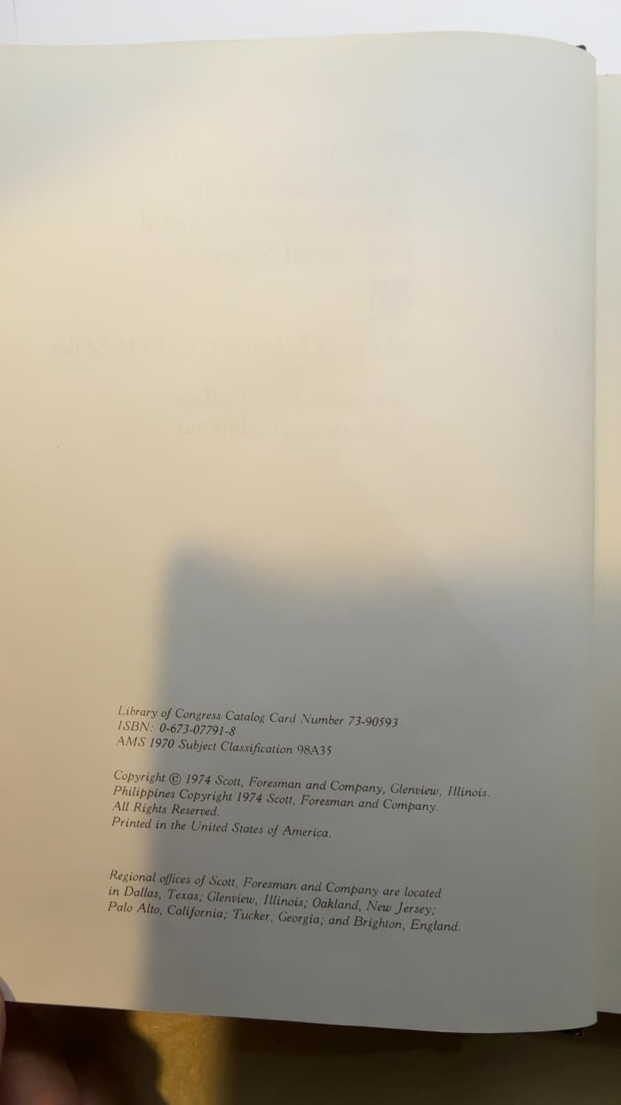 MATHEMATICS: with Applications in the Management, Natural, and Social Sciences by Margaret L. Lial & Charles D. Miller - copyright page showing 1974 details