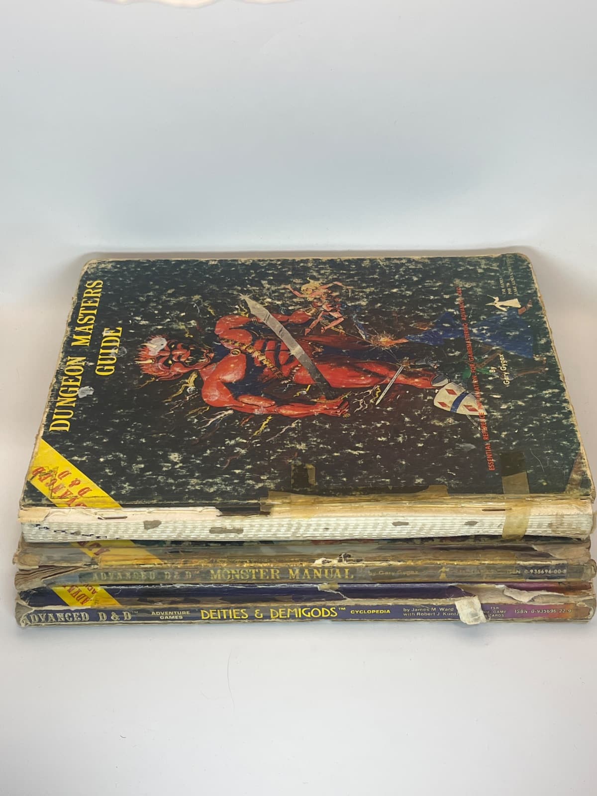 Lot of 3 Dungeons & Dragons 1st Edition Deities & Demigods(Cthulu), DMG, MM, - ACCEPTABLE by Gary Gygax - front cover